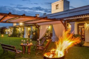 Córdoba Argentina dove hunting lodge — covered outdoor patio with fireplace