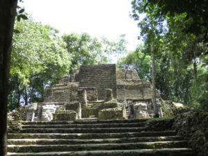 Lamanai Mayan ruins rising from the Belize jungle, ancient stone temple