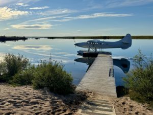 Charter float plane sitting on the dock of the Manitoba caribou hunting lodge 